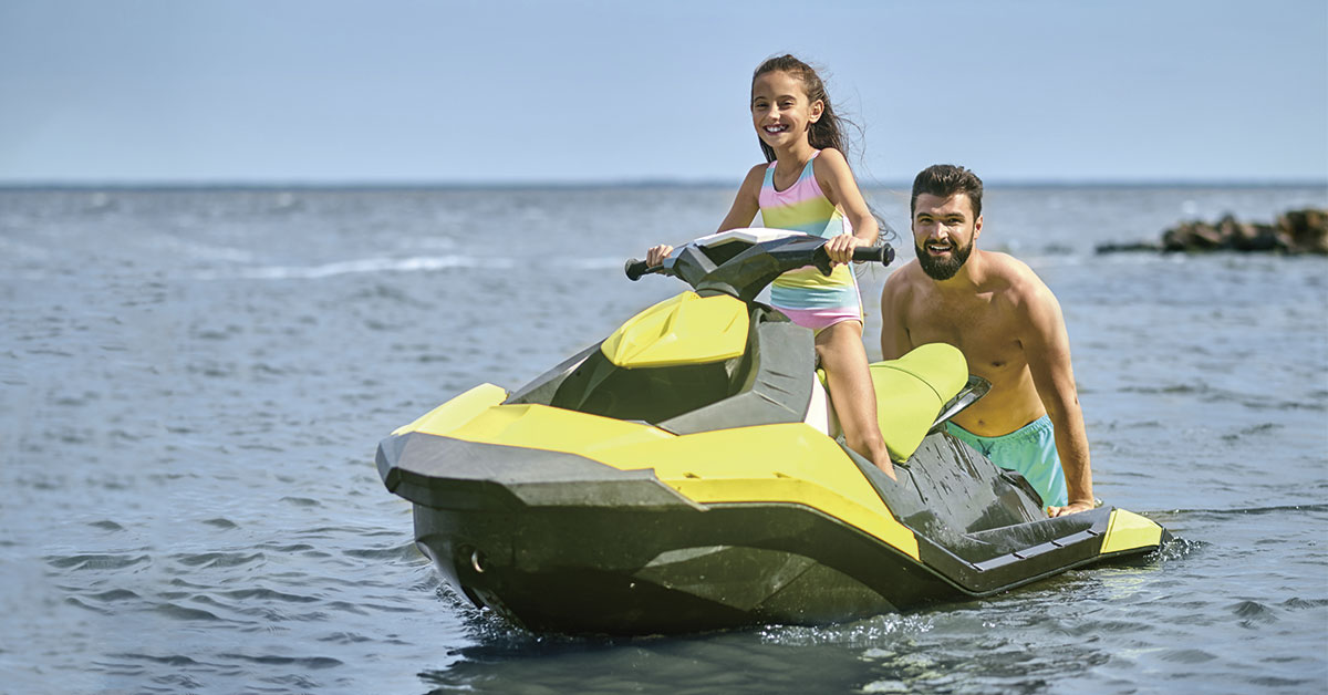 father and daughter on a jet ski